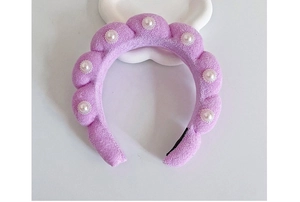 Detail of purple velvet braided headband with floral pearl and bead embellishments