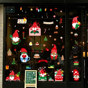 Christmas window decals with cartoon gnomes and festive trucks on glass