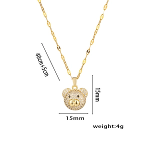 Gold bear pendant necklace with sparkling cubic zirconia and dimensions measurement labels