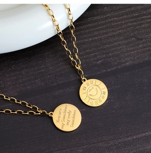 Close-up of golden sunflower smile necklace with engraved You are my Sunshine text