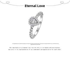 Macro shot of silver pear-shaped ring with pavé diamonds and beaded metal band