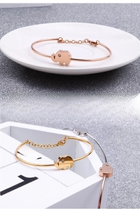 Detail of elephant-shaped stainless steel bracelet with rhinestone eye in various finishes