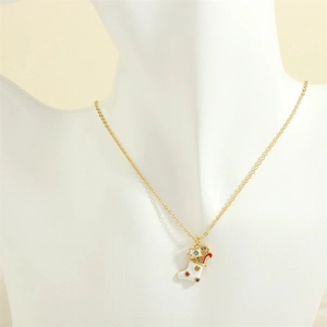 Detailed view of gold Christmas stocking pendant with colorful dots and candy cane on a bust