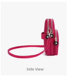 Side view of rose red nylon crossbody phone bag with three layered zipper compartments