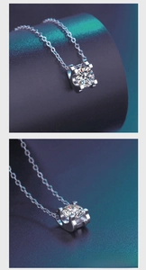 Détail du sertissage à quatre griffes du pendentif moissanite sur chaîne en argent