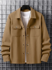 Detailed close-up of khaki corduroy jacket collar, chest pockets and silver metal buttons