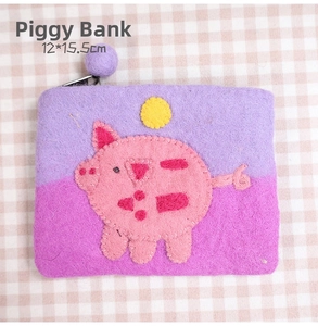 Detail of wool felt coin purse with pig embroidery pattern and 12x15.5cm dimensions