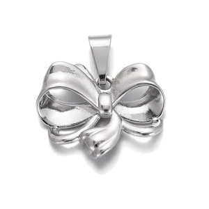 Detail of silver bow-knot pendant with smooth metallic finish for jewelry making