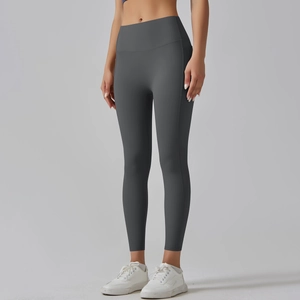 Detail of high-waisted seamless yoga pants in dark grey with side slimming stitch lines