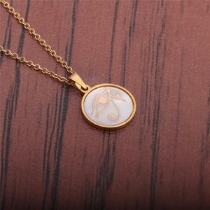Fashionable gold titanium steel necklace with Eye of Horus circular pendant on wood
