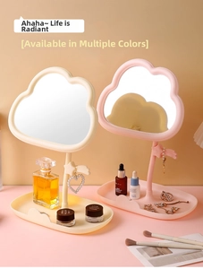 Cloud-shaped makeup mirror detail showing rotating design and star jewelry hooks