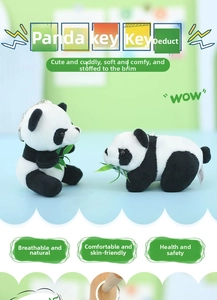 Detail of panda plush keychains with bamboo leaves and soft texture for bags