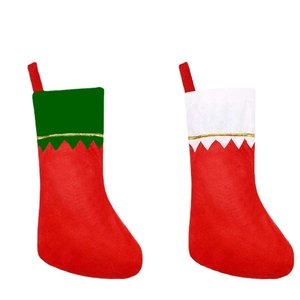 Classic red felt Christmas stockings with white and green cuffs for holiday decorations
