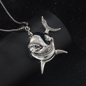 Gothic silver shark head pendant necklace in stainless steel on black leather display
