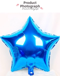 Close-up of 10-inch blue star-shaped foil balloon with metallic mirror finish detail