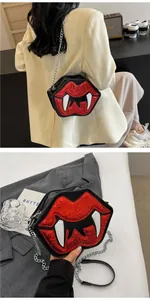 Detail of red sequined lip bag with fangs and silver chain strap for Halloween
