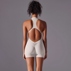 Detail view of the high-stretch racerback design and scrunch butt yoga bodysuit in beige