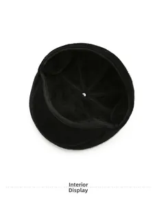 Detail of the thick black faux fur lining and reinforced seams inside the winter flat cap