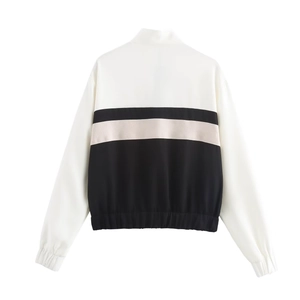 Back view of a casual two-piece tracksuit with black and white color blocking design