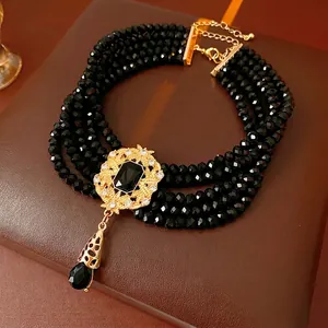 Vintage palace style multilayer black beaded choker with golden flower pendant and teardrop gem