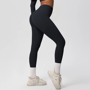 Close-up of black high-waisted yoga pants with premium brushed texture and sculpting fit