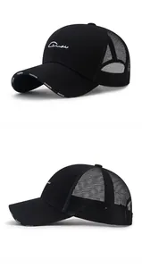 Macro detail of breathable mesh and white Fashion embroidery on black trucker hat