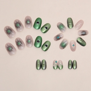 Starry green heart press-on nails set with 3D rhinestones and almond shape design