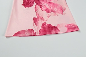 Close-up of pink floral print on soft fabric with high-quality stitching details