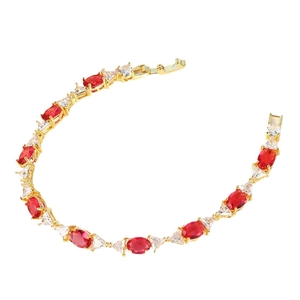 Elegant gold-plated bracelet with oval red gemstones and clear triangular zircons