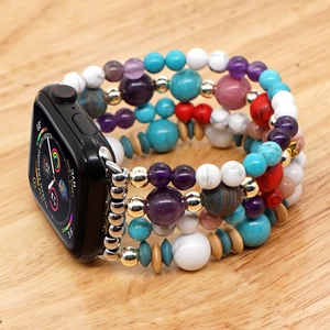 Bohemian beaded Apple Watch strap with turquoise and amethyst beads on wood surface