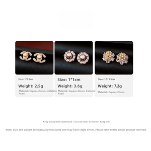Macro view of 14k gold plated flower stud earrings with pearls and shimmering zircons