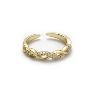Detailed close-up of golden orbital twisted ring with shimmering micro-pave cubic zirconia