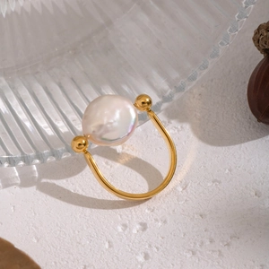 Elegant U-shaped gold stainless steel ring featuring a large baroque freshwater pearl