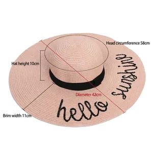 Pink wide brim straw hat with Hello Sunshine embroidery and black ribbon for UV protection