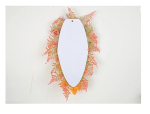 Detail of the back mounting plate with hanging hole for autumn festive pumpkin wreaths