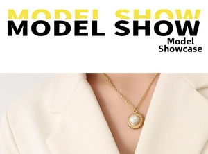Detail of vintage gold twisted chain necklace with a white pearl pendant on a model
