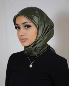 Close-up of elegant olive green satin hijab featuring smooth texture and silk-like shine