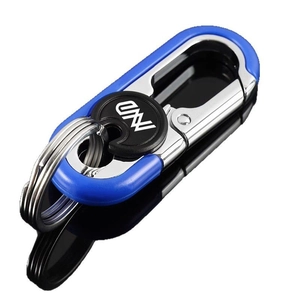 Premium blue and silver metallic keychain with stylized W logo on a reflective black surface