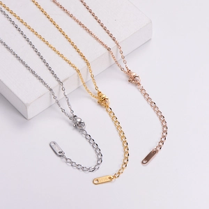 Detail of three-color 18KGP titanium steel chains in gold, silver, and rose gold