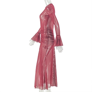 Detail of red polka dot mesh dress featuring flared sleeves and ruched slimming waist
