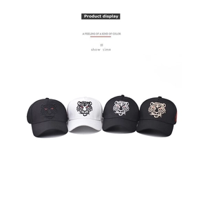 Detailed view of intricate tiger head embroidery on four different cotton baseball caps