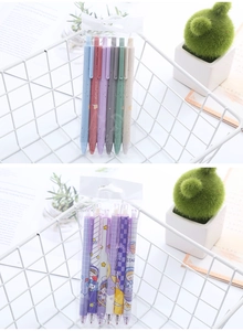 Detail of 6-piece retractable gel pens in solid colors and astronaut cartoon patterns