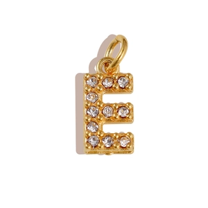 Detailed view of a gold-plated letter E pendant set with sparkling cubic zirconia stones