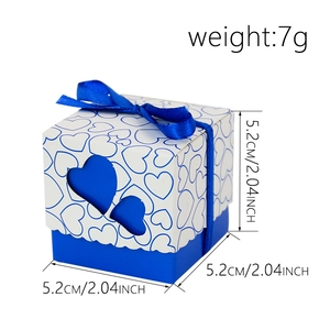 Blue and white hollow heart wedding candy box with ribbon bow measuring 5.2cm