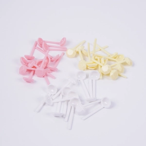 Miniature colorful dollhouse spoons for kitchen play models in pink, yellow and white