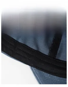 Macro view of wide black sweatband inside blue canvas baseball cap with reinforced stitching