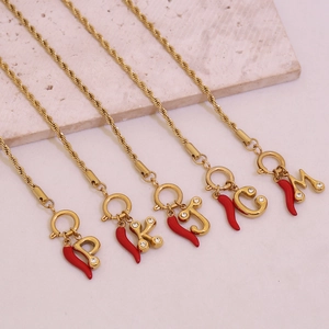 Gold-plated twist chain bracelet with red chili pepper and pavé letter pendants