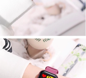 Close-up of square LED digital watch with heart rate monitor icon and purple strap