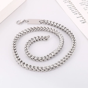 Detailed close-up of a silver titanium steel keel chain necklace with a blank square tag