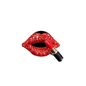 Sparkling crystal red lips and lipstick car air vent aroma clip on white background